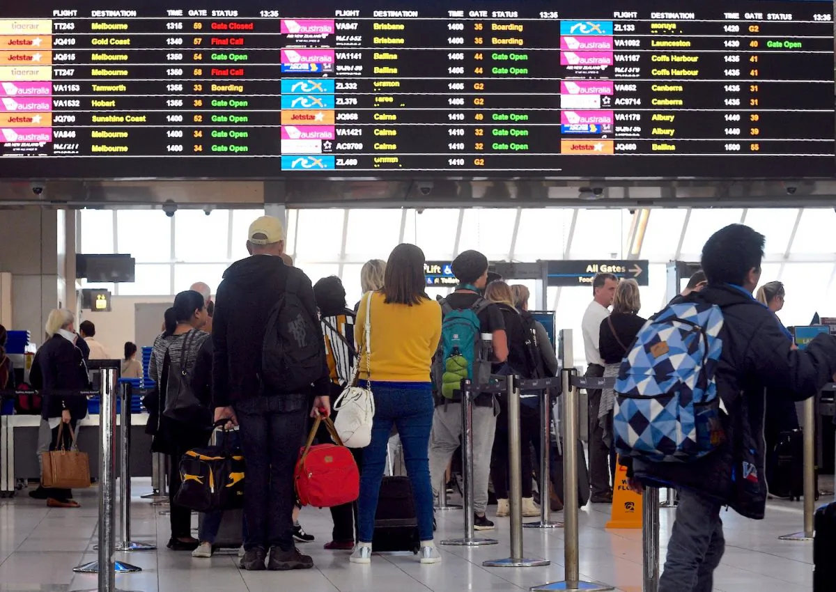 Passengers queue at a security check point at Sydney Airport on July 30, 2017. (WILLIAM WEST/AFP/Getty Images)
