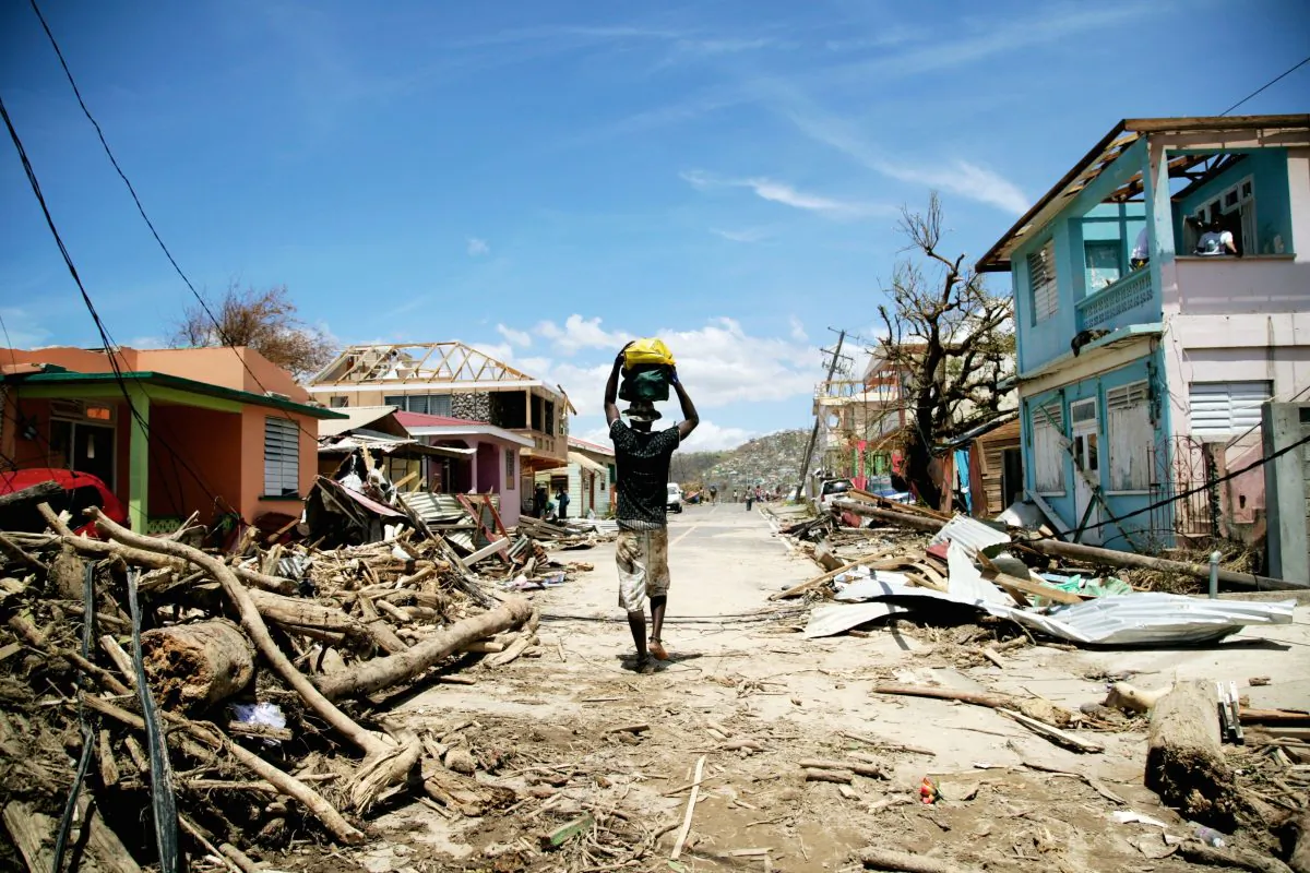 A man walks amid destruction in Roseau, the capital of Dominica, after Hurricane Maria damages the island, on September 23, 2017. (Cedrick Isham Calvados/AFP/Getty Images)