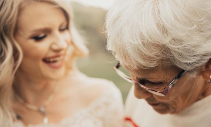 Jordyn Cleverly shares a moment with her grandmother Penny Jenson after revealing her wedding dress. (Kortney Peterson/KORTNEY J PHOTOGRAPHY)