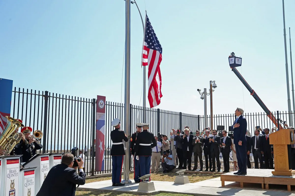 Then Secretary of State John Kerry (R) watches as Marines raise the American flag at the U.S. Embassy in Havana, Cuba. on Aug. 14, 2015. (Chip Somodevilla/Getty Images)