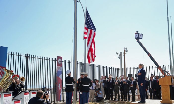 Then Secretary of State John Kerry (R) watches as Marines raise the American flag at the U.S. Embassy in Havana, Cuba. on Aug. 14, 2015. (Chip Somodevilla/Getty Images)