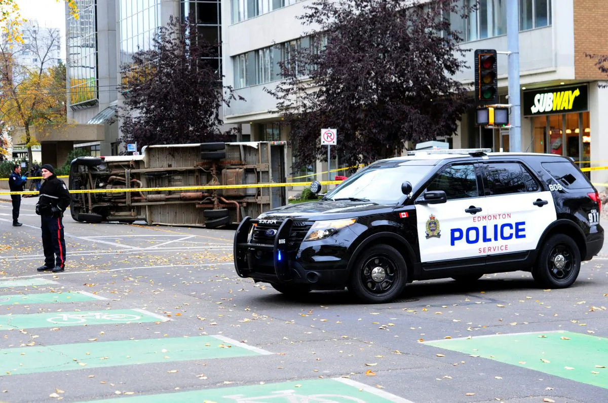 An Edmonton Police car parks at the site of an investigation in front of the Matrix Hotel in Edmonton, Alberta, on Oct. 1, 2017.  (Candace Elliott/Reuters)