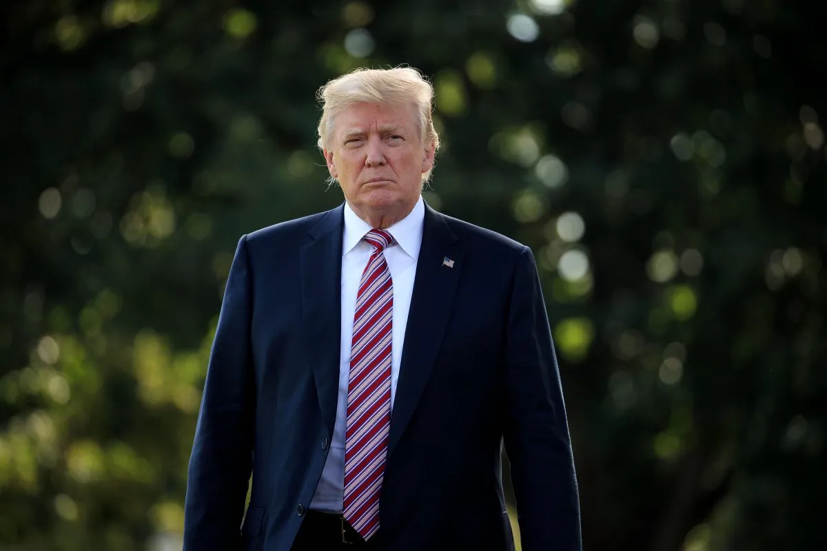 President Donald Trump walks toward reporters before boarding Marine One on the South Lawn of the White House in Washington, on Sept. 29, 2017. (Drew Angerer/Getty Images)