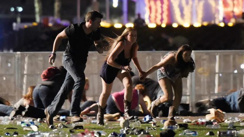 People run from the Route 91 Harvest country music festival after apparent gun fire was hear on Oct. 1, 2017 in Las Vegas. (David Becker/Getty Images)