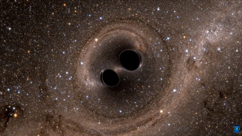 The collision of two black holes—an event detected for the first time ever by the Laser Interferometer Gravitational-Wave Observatory, or LIGO—is seen in this still from a computer simulation. (Courtesy of SXS Project/California Institute of Technology/Handout via REUTERS)