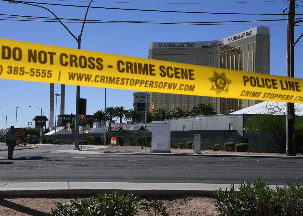 The damaged window on the 32nd-floor room of the Mandalay Hotel that was used by killer Stephen Paddock to fire upon people attending the Route 91 music festival last Sunday, killing 59 people and wounding more than 500 others. Images of two of Paddock’s rifles, one indicating recent use, have been obtained by media. (Mark Ralston/AFP/Getty Images)