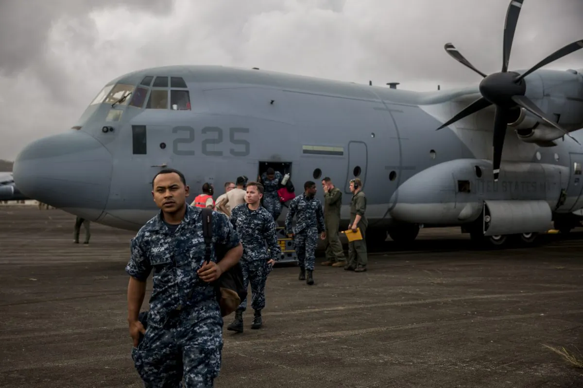 U.S. Marines and Sailors exit a KC-130J Super Hercules aircraft at the Jose Aponte de la Torre Airport to provide aid and hurricane relief in Puerto Rico on Sept. 27, 2017. (U.S. Marine Corps photo by Lance Cpl. Cody J. Ohira/Released)