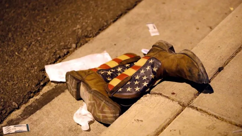 A pair of cowboy boots is shown in the street outside the concert venue after a mass shooting at a music festival on the Las Vegas Strip in Las Vegas. (Reuters/Las Vegas Sun/Steve Marcus)