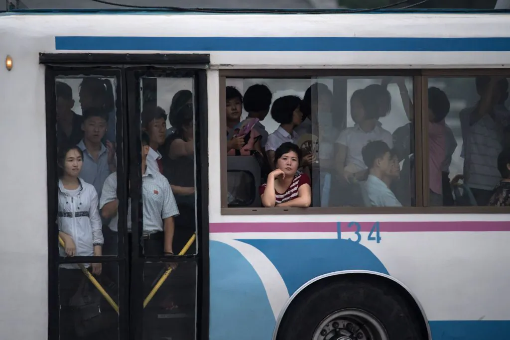 People take a bus in Pyongyang on July 21, 2017. (ED JONES/AFP/Getty Images)
