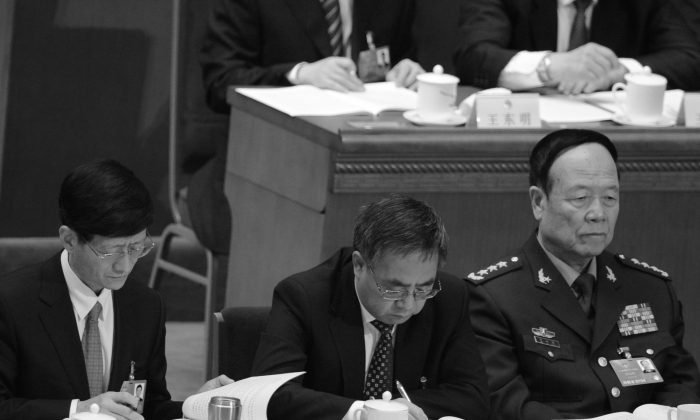 Former vice chairman of the Central Military Commission, Guo Boxiong, at far right, on March 5, 2013. (Goh Chai Hin/AFP/Getty Images)