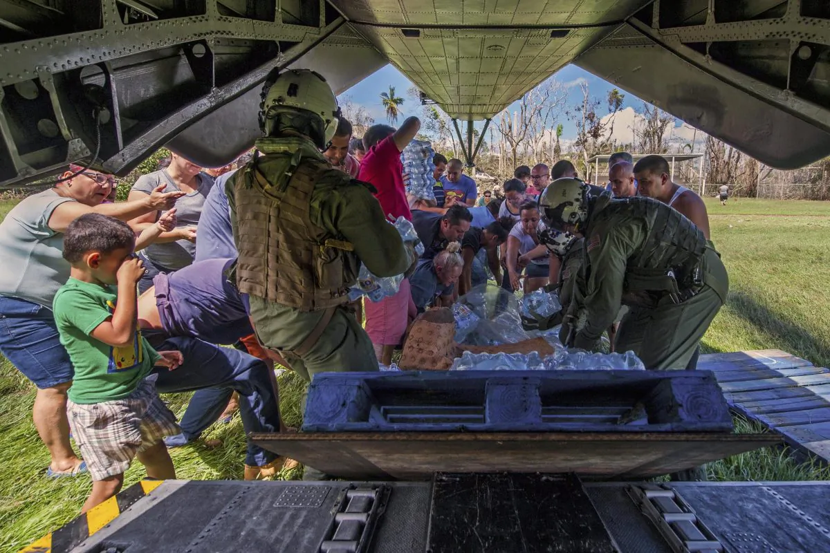 Sailors deliver supplies from an MH-53E Sea Dragon helicopter during relief efforts in Puerto Rico, Oct. 5, 2017. (Navy photo by Petty Officer 3rd Class Michael Molina)
