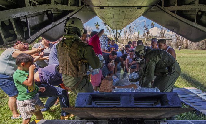 Sailors deliver supplies from an MH-53E Sea Dragon helicopter during relief efforts in Puerto Rico, Oct. 5, 2017. (Navy photo by Petty Officer 3rd Class Michael Molina)
