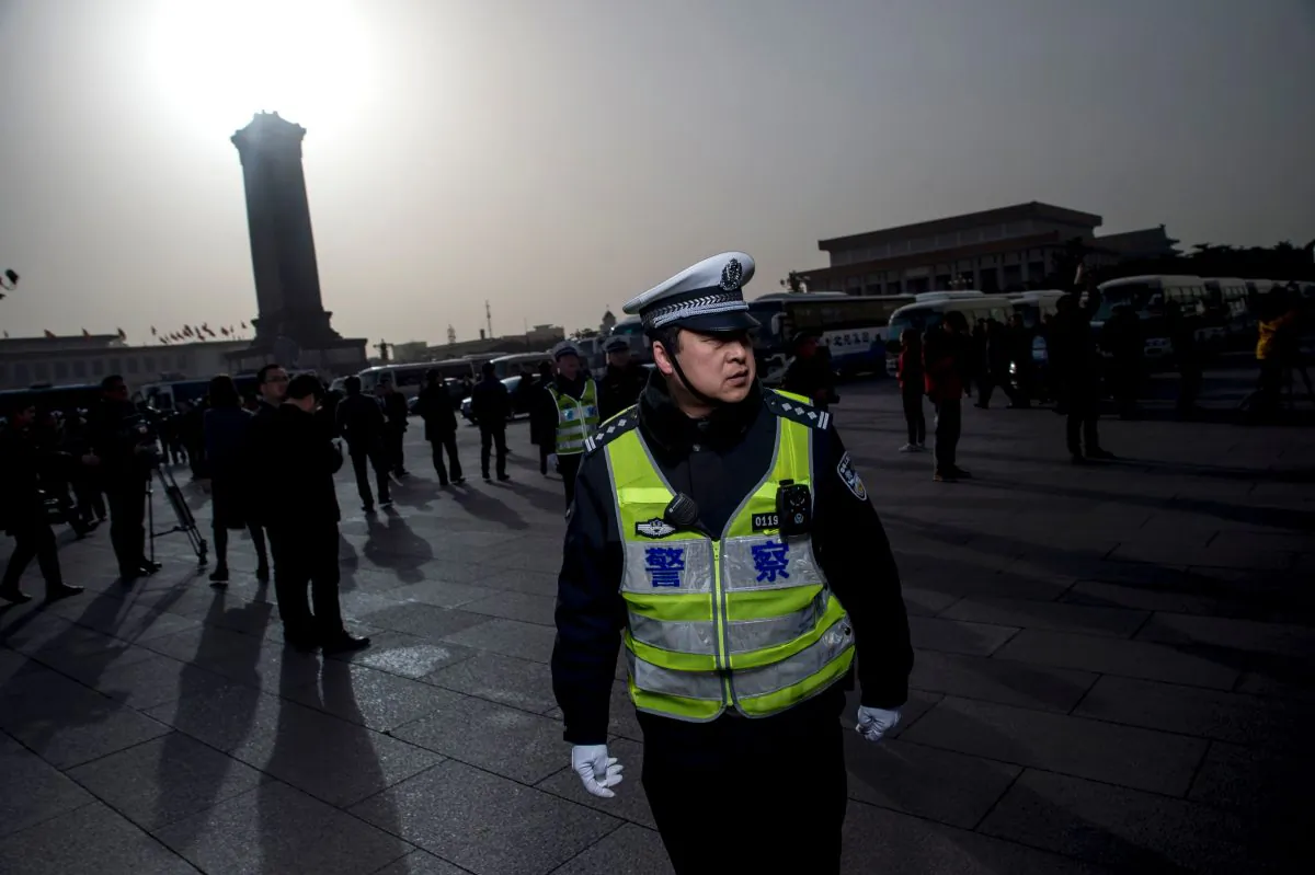 A policeman stands at the Great Hall of the People in Beijing on March 5, 2016. 
(Fred Dufour/AFP/Getty Images)