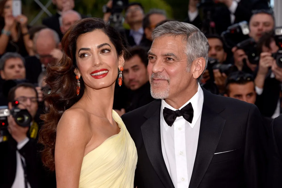 Amal Clooney and her husband George Clooney at the Cannes Film Festival in France, on May 12, 2016. (Clemens Bilan/Getty Images)