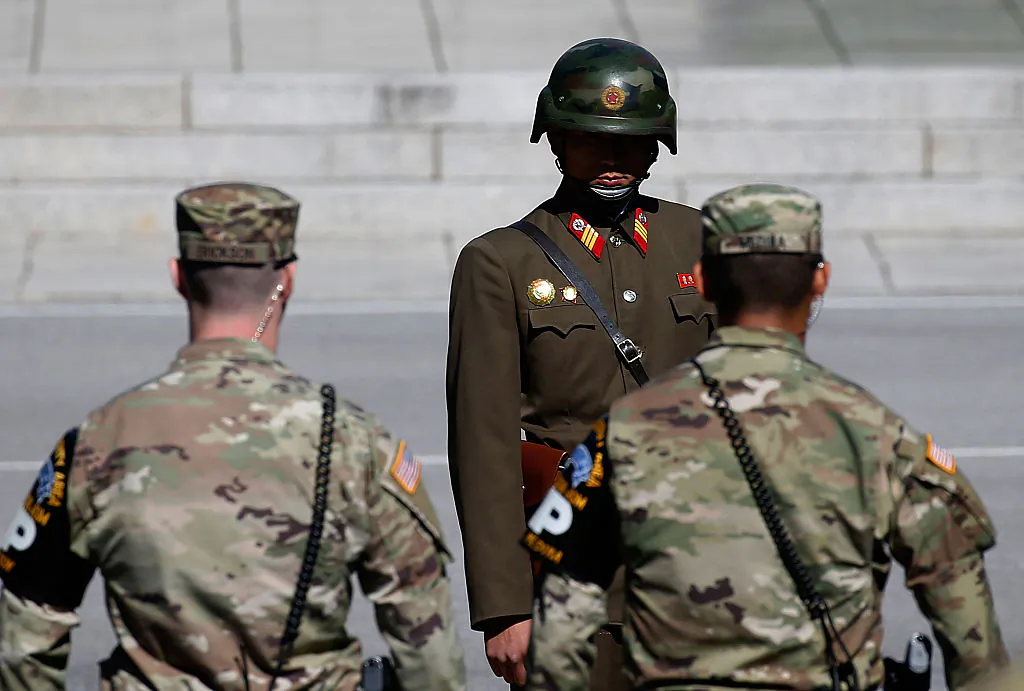A North Korean soldier (back) stands guard at the Military Demarcation Line in the border village of Panmunjom between South and North Korea in Panmunjom, South Korea on Oct. 9, 2016. (Jeon Heon-Kyun-Pool/Getty Images)