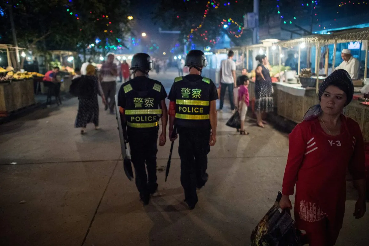 Police patrol a night market near the Id Kah Mosque in Kashgar, Xinjiang, on June 25, 2017. (Johannes Eisele/AFP/Getty Images)