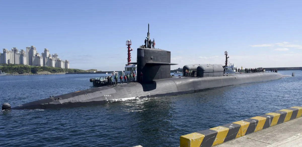 The Ohio-class guided-missile submarine USS Michigan (SSGN 727) pulls into the pier of Republic of Korea's Busan Naval Base as part of a routine port visit on Oct. 13. (U.S. Navy photo by Mass Communication Specialist Seaman William Carlisle)