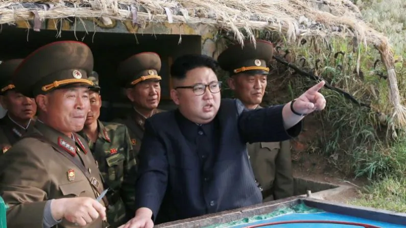 This undated picture released from North Korea's official Korean Central News Agency (KCNA) on May 5, 2017 shows North Korean leader Kim Jong-Un (C) inspecting the defense detachment on Jangjae Islet and the Hero Defense Detachment on Mu Islet located in the southernmost part of the waters off the southwest front. (AFP/Getty Images)