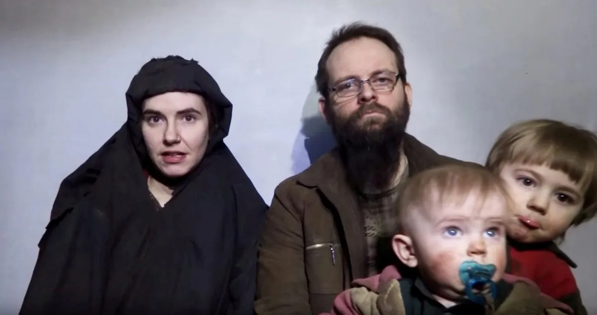 A still image from a video posted by the Taliban on social media on Dec. 19, 2016, shows American Caitlan Coleman (L) and next to her Canadian husband Joshua Boyle and their two sons.   (Courtesy Taliban/Social media via Reuters)