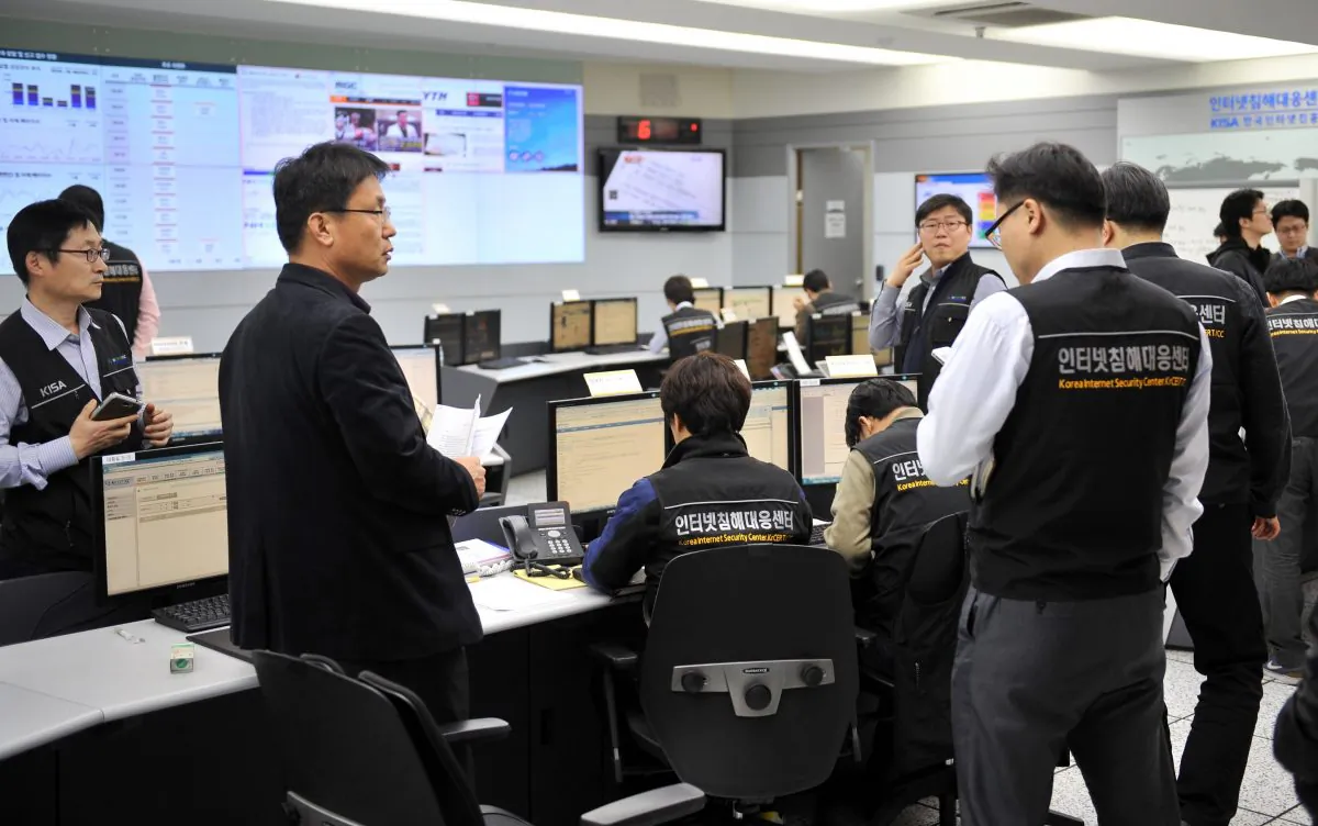 In this file photo, members of the Korea Internet Security Agency (KISA) check on cyberattacks at a briefing room in Seoul on March 20, 2013. South Korea is scrambling to patch up vulnerabilities in cyberspace, after a shocking report that North Korean hackers had stolen a large cache of military documents in 2016. (Jung Yeon-Je/AFP/Getty Images)