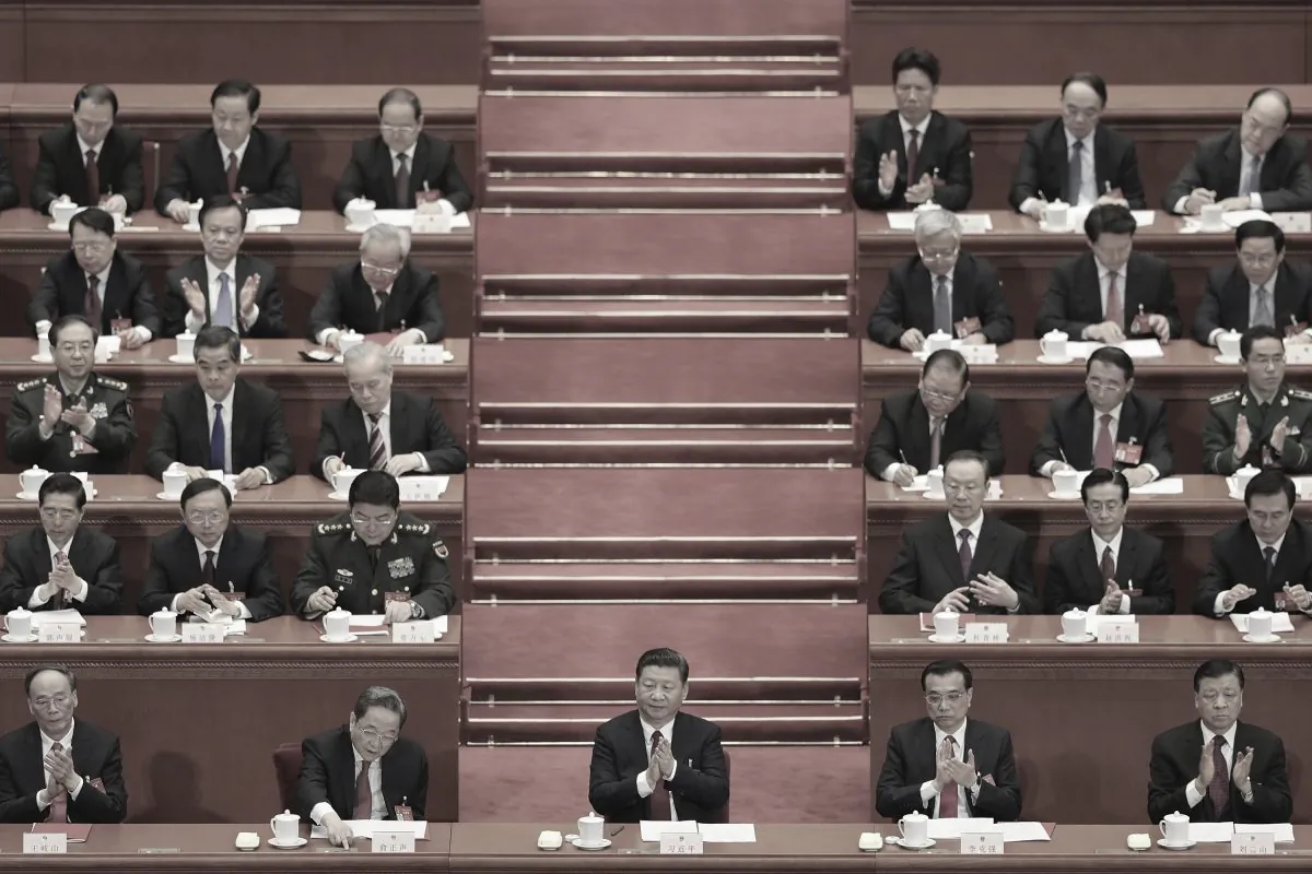 Chinese leader Xi Jinping (center) and top leaders attend a party summit, the National People's Congress, in Beijing on March 15, 2017. (Photo by Lintao Zhang/Getty Images)