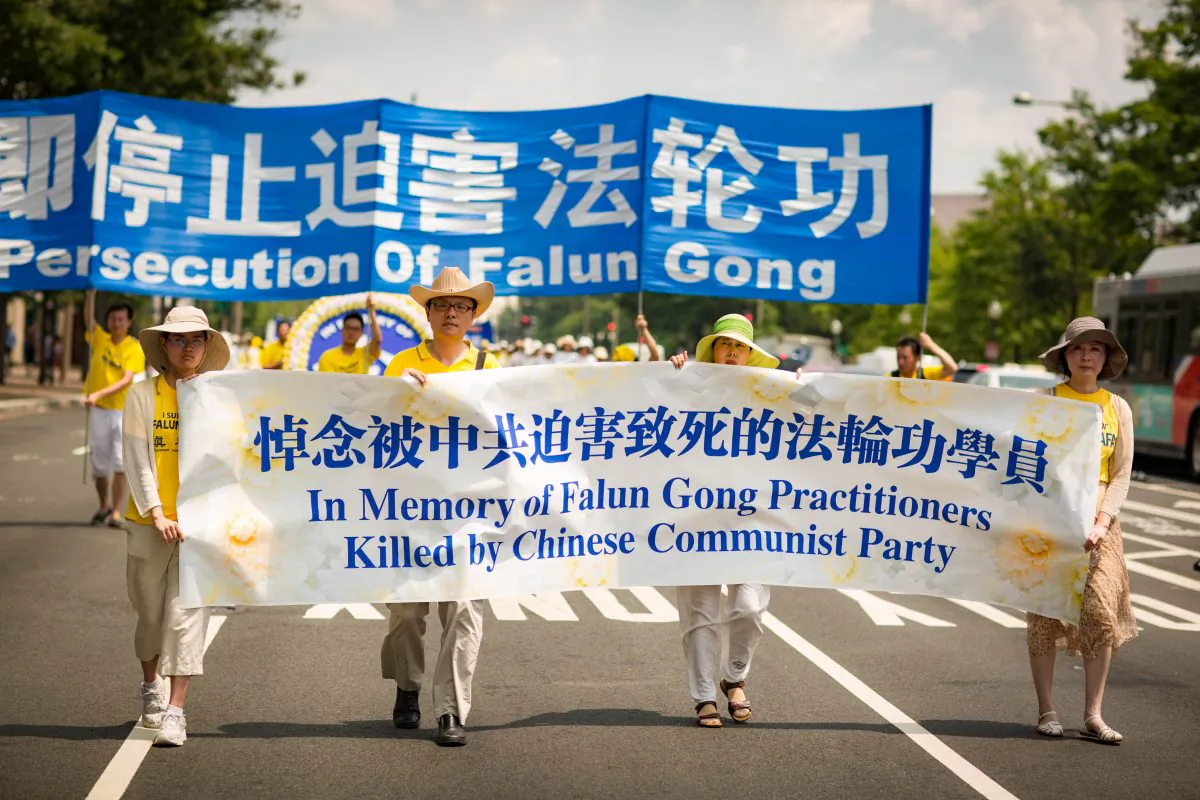 Hundreds of Falun Gong practitioners march in Washington, D.C. to call for an end to the persecution of practitioners in China, on July 20, 2017. (Benjamin Chasteen/The Epoch Times)