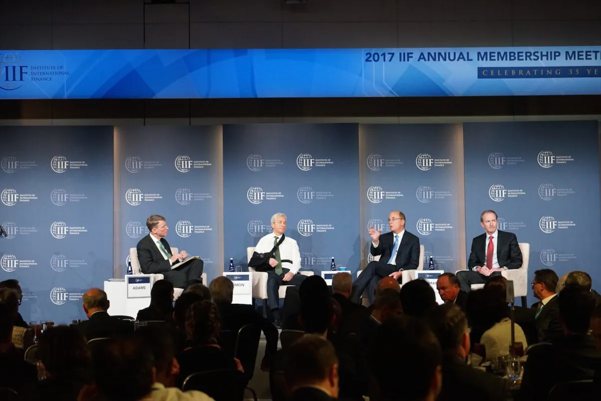 (L–R) Tim Adams, president and CEO of the Institute of International Finance (IIF), Jamie Dimon, chairman and CEO of JPMorgan Chase, Laurence Fink, chairman and CEO of BlackRock, and James Gorman, chairman and CEO of Morgan Stanley, at a panel discussion during the annual meeting of the IIF in Washington on Oct. 13, 2017. (Courtesy of IIF)