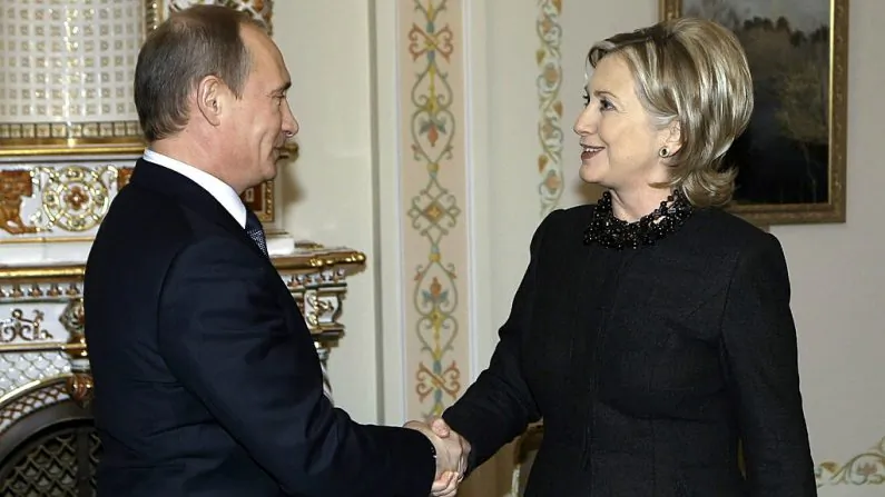 Secretary of State Hillary Clinton shakes hands with Russian Prime Minister Vladimir Putin outside Moscow in Novo-Ogarevo on March 19, 2010. (Alexey Nikolsky/AFP/Getty Images)