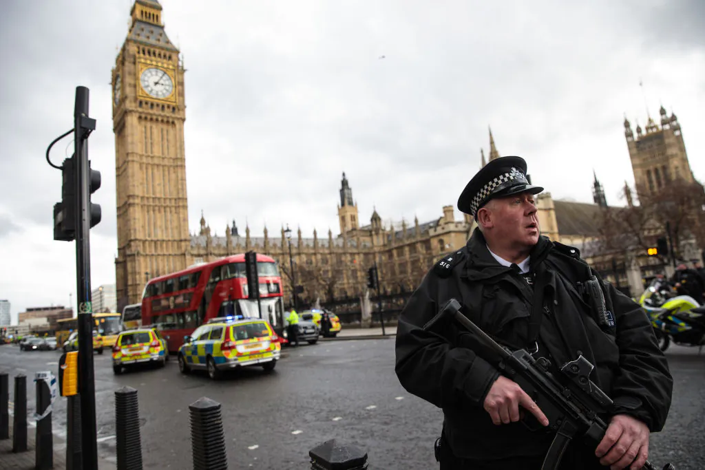 An armed police officer stands guard near Westminster Bridge and the Houses of Parliament in London on March 22, 2017, following a terrorist incident. (Jack Taylor/Getty Images)