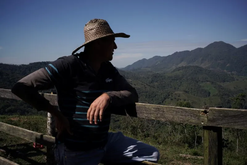 Libardo Garcia, a farmer who was displaced during the terrorist violence and returned to grow coffee with his family, looks out in San Carlos, Colombia July 13, 2017. (REUTERS/Federico Rios)