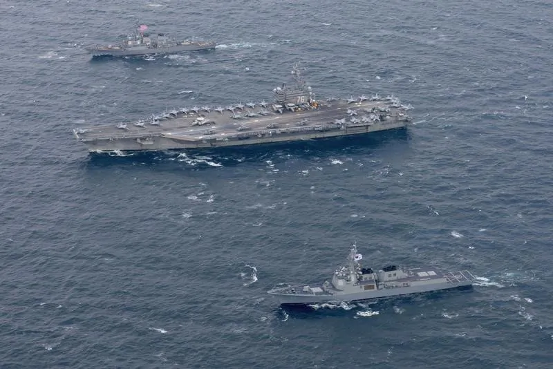 The Navy's forward-deployed aircraft carrier USS Ronald Reagan and the forward-deployed Arleigh Burke-class destroyer USS Stethem steam alongside ships from the Republic of Korea Navy in the waters east of the Korean Peninsula on Oct. 18, 2017. (Kenneth Abbate/U.S. Navy/Handout via REUTERS)