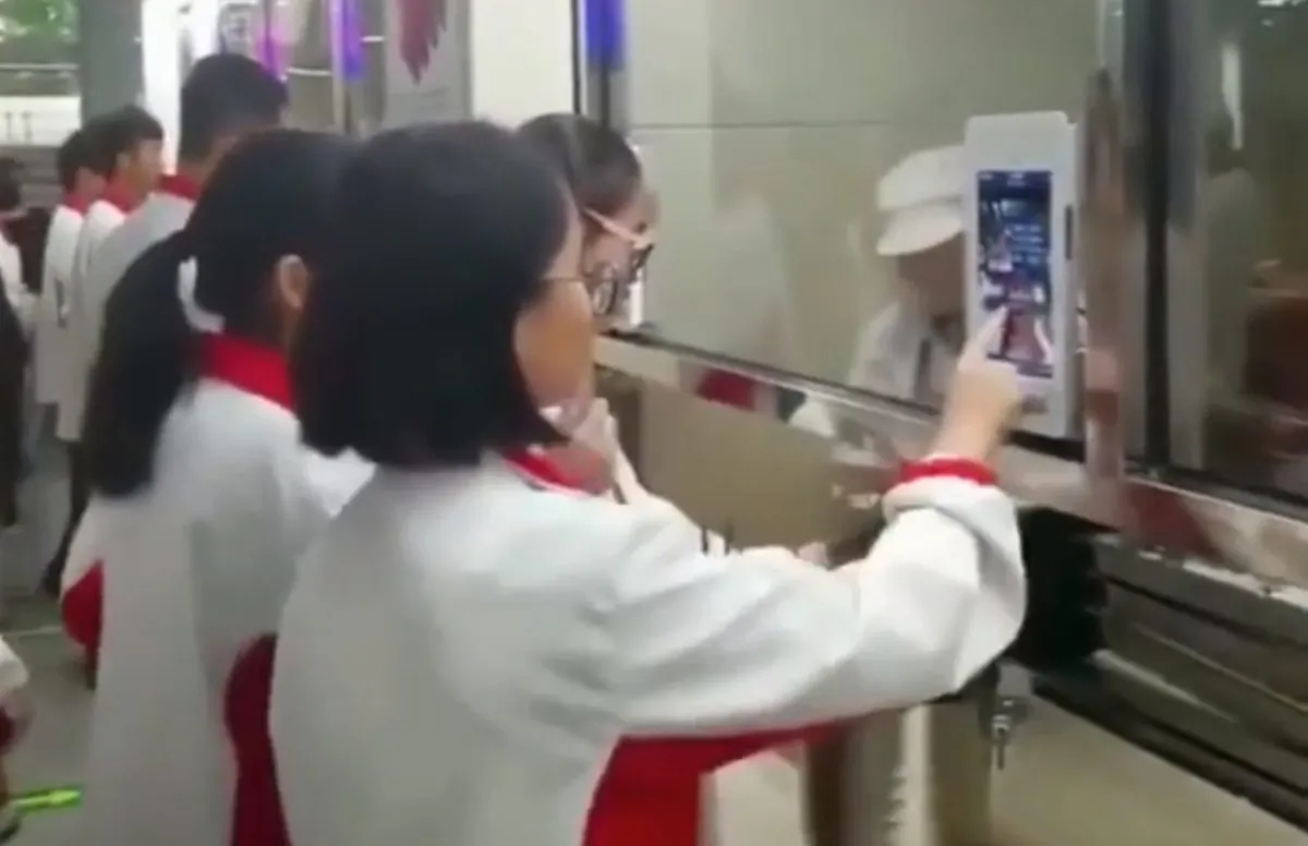A High School in China now subjects students to facial recognition before they could be served lunch in the cafeteria. (Screenshot from Youku video/Epoch Times)