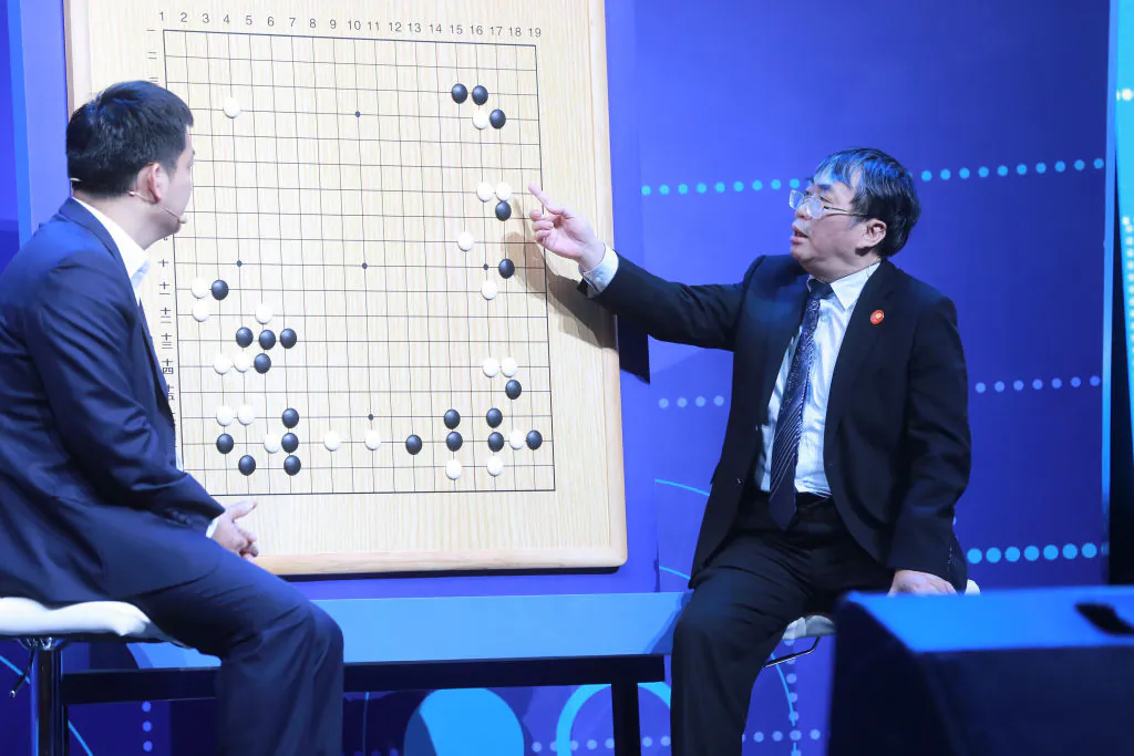 Experts review moves during the Go match between 19-year-old Ke Jie and Google's artificial intelligence program AlphaGo in Wuzhen, in eastern China's Zhejiang Province on May 27, 2017.
(STR/AFP/Getty Images)
