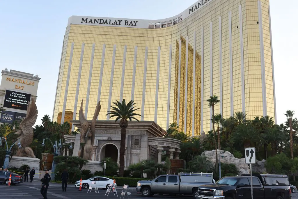 Police stand near the The Mandalay Bay Hotel and Casino in Las Vegas on Oct. 4, 2017, before the windows Stephen Paddock broke for his shooting spree were repaired. A judge has order the hotel to preserve evidence as a civil suit is argued over the hotels alleged negligence.  MGM Resorts International has said it will not be renting out the suite. (ROBYN BECK/AFP/Getty Images)