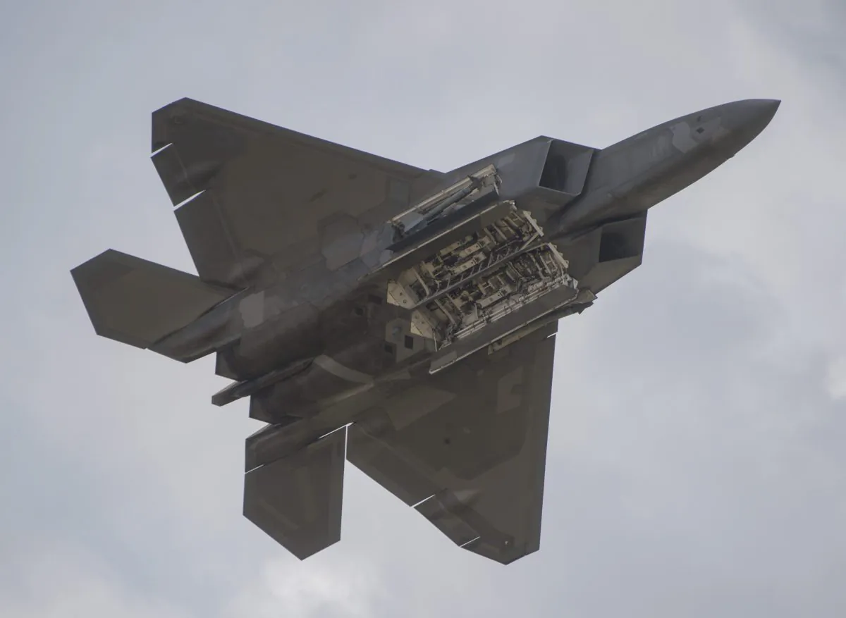 An F-22 Raptor shows the internal bays as it does a fly-by during the airshow at Joint Andrews Air Base in Maryland on Sept. 16, 2017. (Andrew Caballero-Reynolds/AFP/Getty Images)