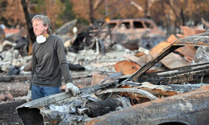 Car collector Gary Dower speaks with neighbors at his fire-destroyed home in Santa Rosa, Calif., on Oct. 20, 2017. 
(Josh Edelson/AFP/Getty Images)