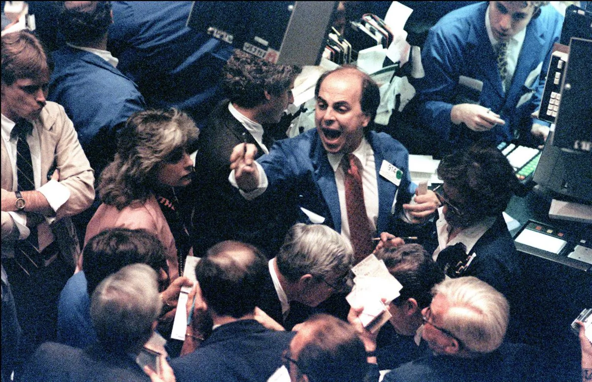 A trader shouts orders on the New York Stock Exchange in this file photo. While markets have cooled a bit, investors are too confident markets will continue to rise.
(MARIA BASTONE/AFP/Getty Images)