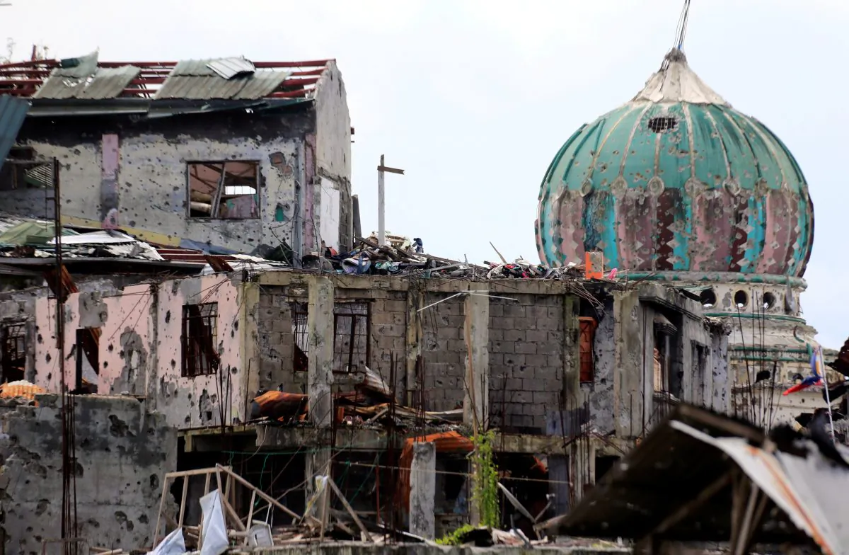 Damaged houses and buildings are seen after government troops cleared the area from pro-ISIS insurgent groups inside the war-torn area in Saduc proper, Marawi city, southern Philippines Oct. 22, 2017.
 (Reuters/Romeo Ranoco)