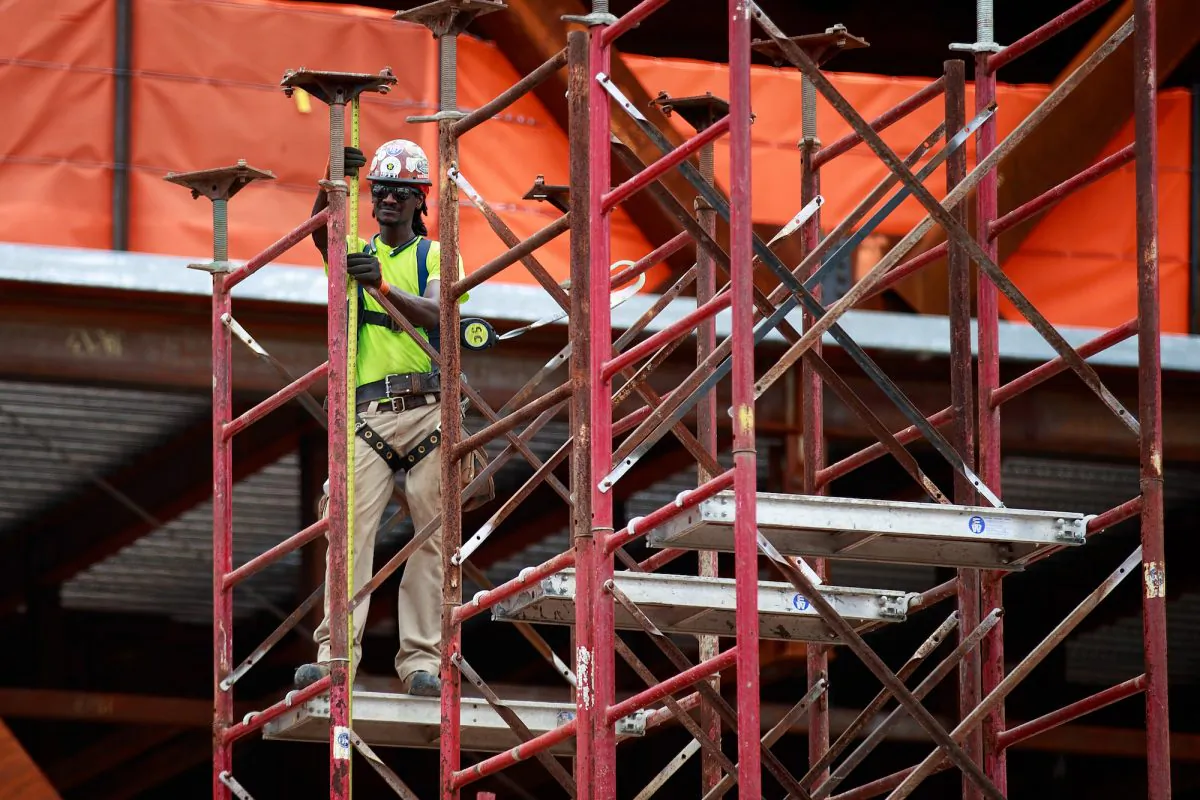 A construction laborer works on the site of a new residential building in the Hudson Yards development in New York on Aug. 22, 2017. (Drew Angerer/Getty Images)