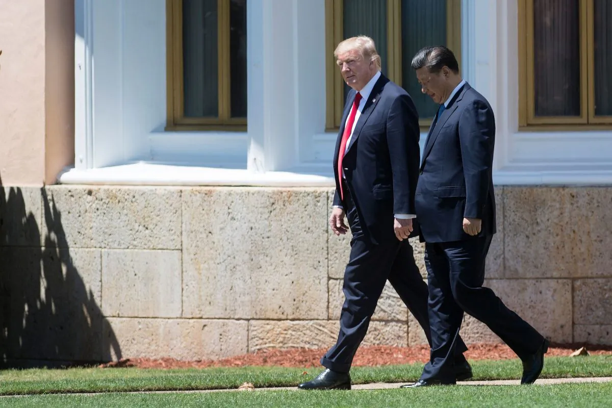 U.S. President Donald Trump (L) and Chinese leader Xi Jinping (R) walk together at the Mar-a-Lago estate in West Palm Beach, Florida, on April 7, 2017. (Jim Watson/AFP/Getty Images)
