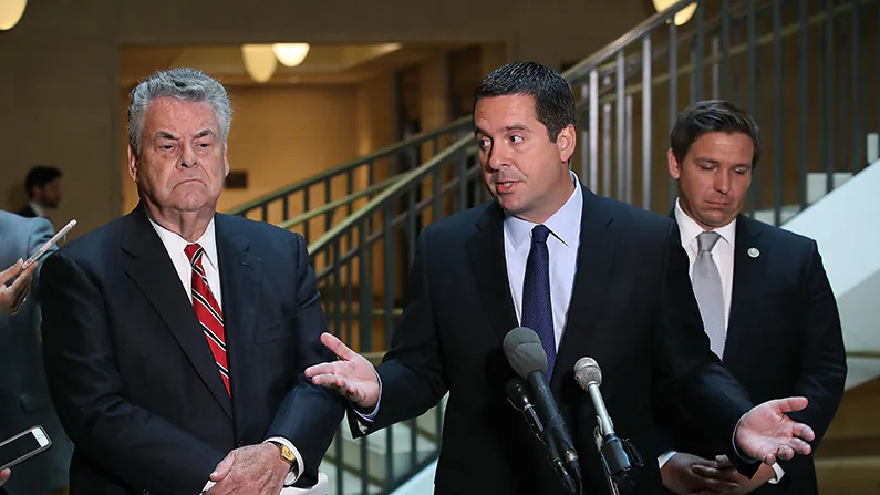 House Intelligence Committee Chairman Devin Nunes (R-Calif.)(C) stands with Rep. Peter King (R-N.Y.), (L) and Rep. Don DeSantis (R-Fla.) as he announces that his committee and the House oversight committee are starting the investigation into the Russia-Obama Administration uranium deal. (Mark Wilson/Getty Images)