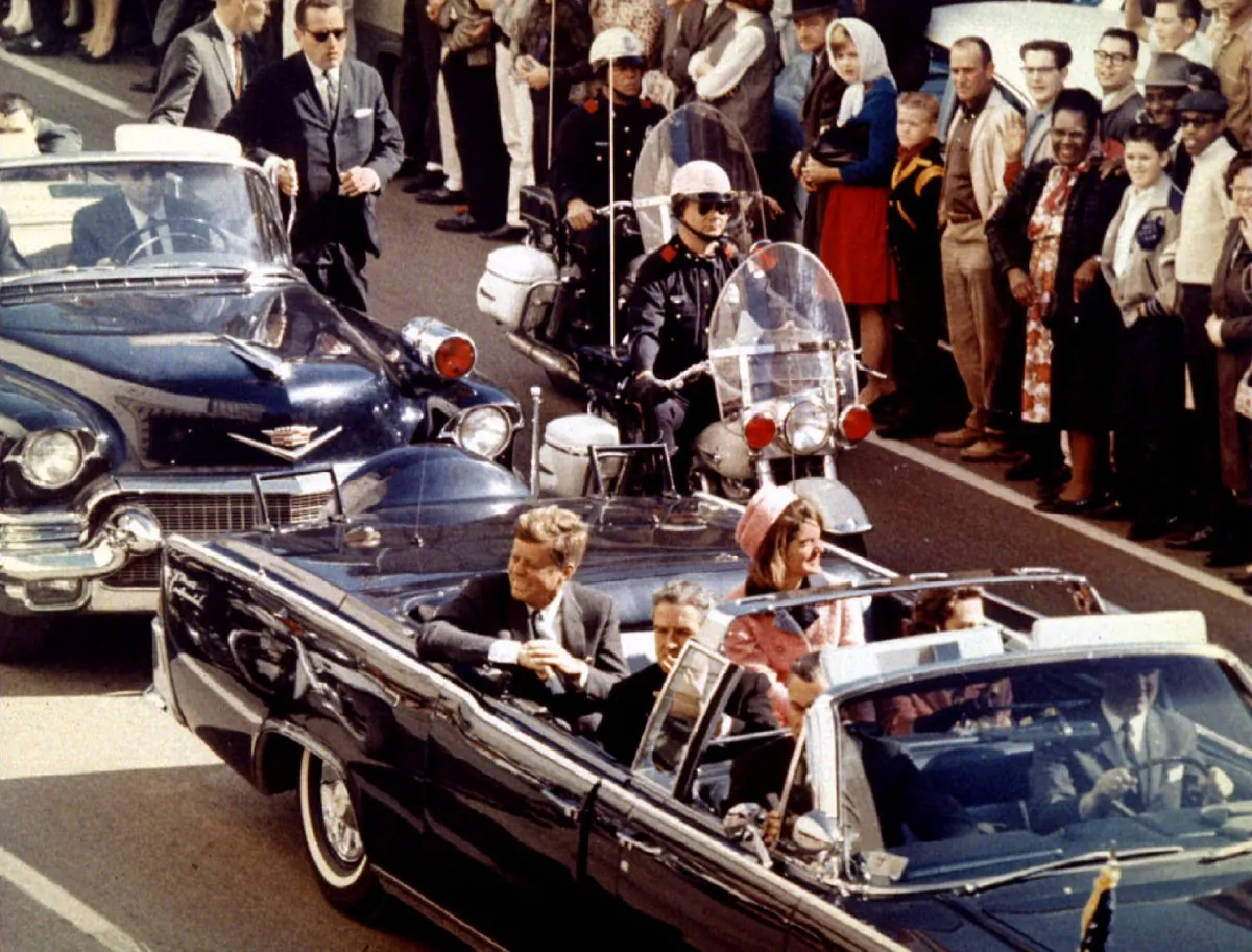 President John F. Kennedy, First Lady Jaqueline Kennedy, and Texas Gov. John Connally ride in a limousine moments before Kennedy was assassinated, in Dallas, Texas, on Nov. 22, 1963. (Walt Cisco/Dallas Morning News/Handout via Reuters)