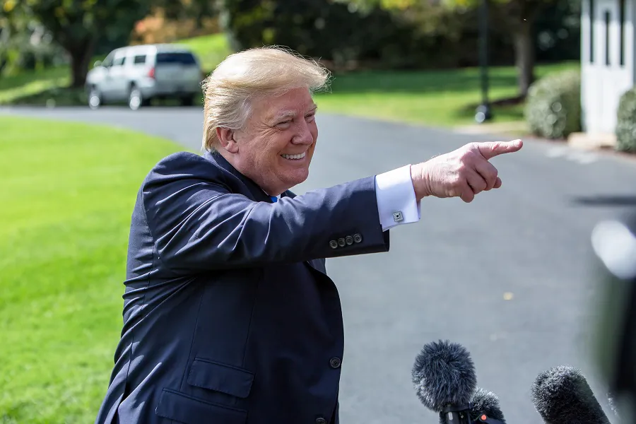 President Donald Trump talks to the press before leaving the White House from the South Lawn in Marine One on Oct. 25, 2017. (Samira Bouaou/The Epoch Times)