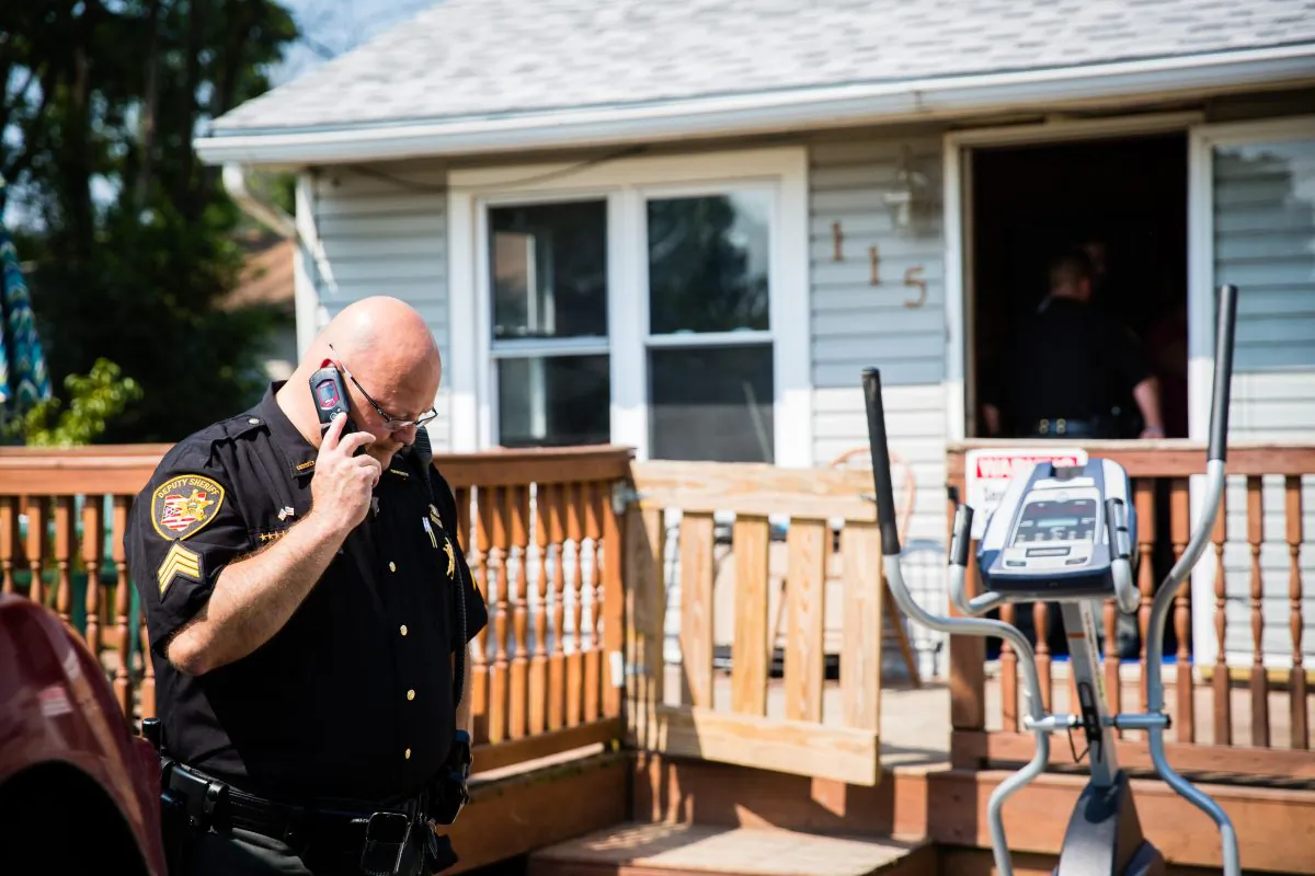 A deputy from the Montgomery County Sheriffâs Office and staff from the Montgomery County Coroner, at the home of a man who was found dead from an apparent drug overdose in the Drexel neighborhood of Montgomery County, Ohio, on Aug. 3, 2017. (Benjamin Chasteen/The Epoch Times)