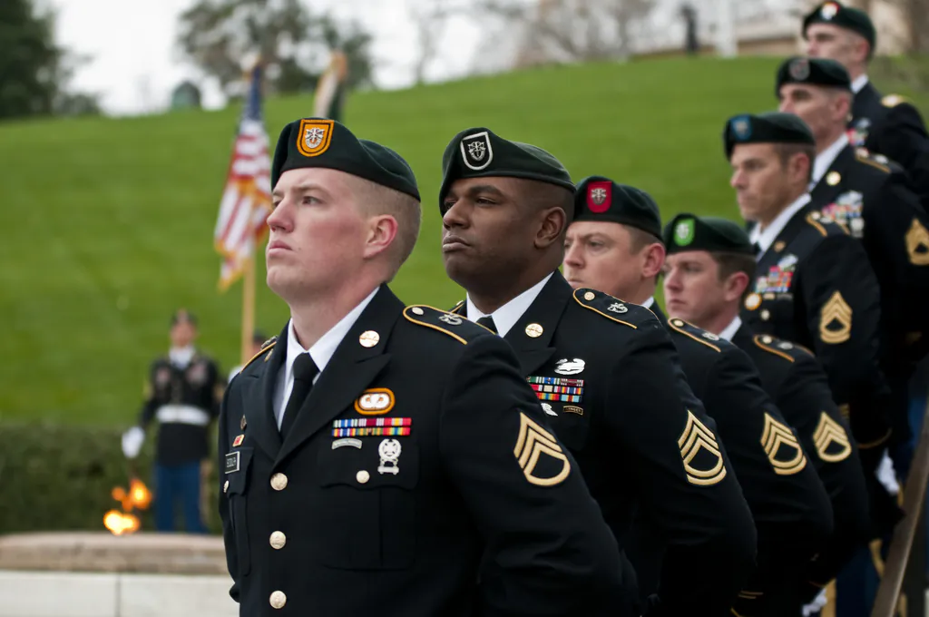 Soldiers from each of the U.S. Army’s Special Forces groups stand silent during the wreath-laying ceremony at the grave of President John F. Kennedy at Arlington National Cemetery on Nov. 17, 2011. (U.S. Army)