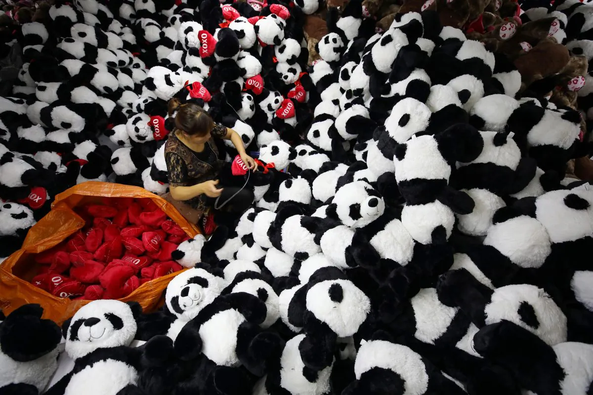 A Chinese worker makes stuffed panda toys for export at a toy factory in Lianyungang, Jiangsu Province on Oct. 9, 2017. A recent survey placed China at the bottom of a “Made-in-Country Index.” (STR/AFP/Getty Images)