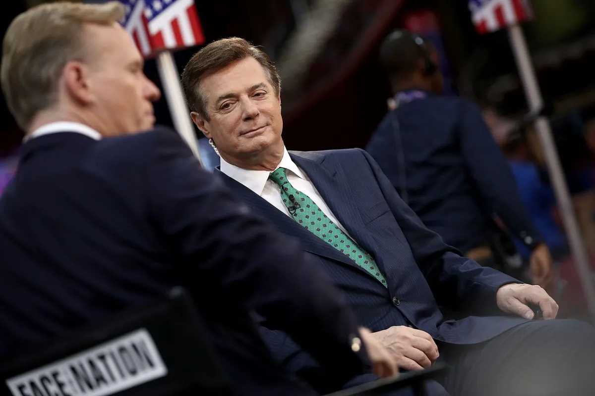 Paul Manafort (R) is interviewed on the floor of the Republican National Convention at the Quicken Loans Arena in Cleveland on July 17, 2016. (Win McNamee/Getty Images)