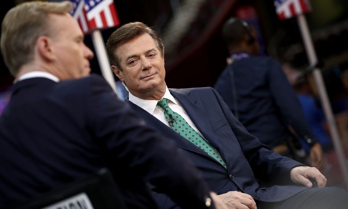 Paul Manafort (R) is interviewed on the floor of the Republican National Convention at the Quicken Loans Arena in Cleveland on July 17, 2016. (Win McNamee/Getty Images)