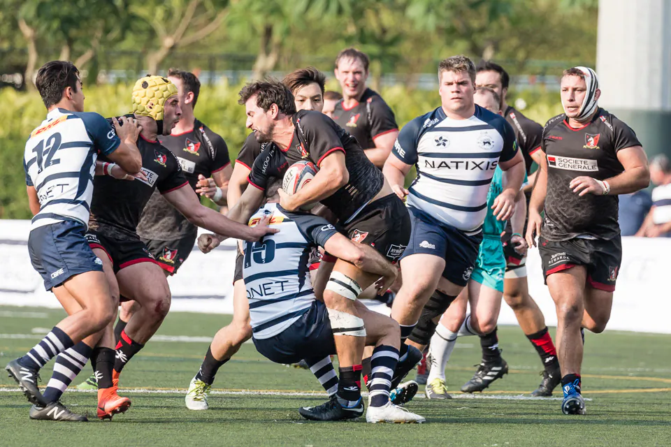 Valley No 24 Centre Ally Maclay being tackled by Club No 15 fullback Glyn Hughes, with Club No 12 Jack Abbott and Valley No12 Sean Conner (scrum cap) also in the frame during their HKRU Premiership match at Valley 6 on Saturday Oct 28, 2017. (Dan Marchant)