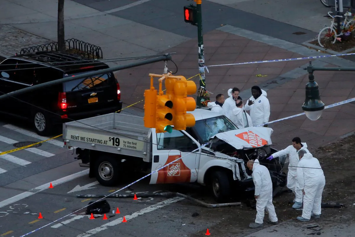 Police investigate a vehicle on the West Side Highway in Manhattan on Oct. 31, 2017. (REUTERS/Andrew Kelly)